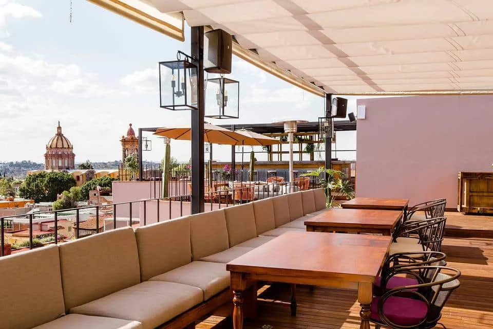The Rooftop at Selina with open-air seating and city views
