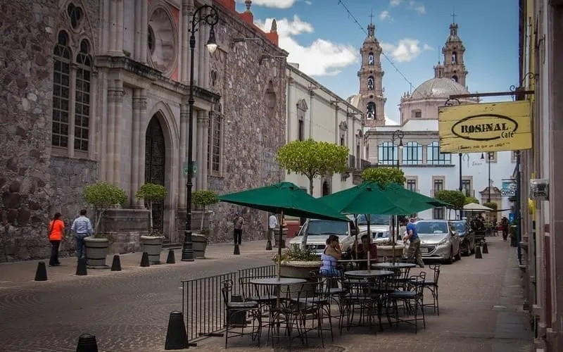 Historic plaza in Aguascalientes under cloudy early-summer skies