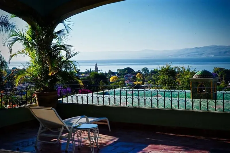 Lake Chapala shoreline near Ajijic with blue water, mountains, and clear spring light