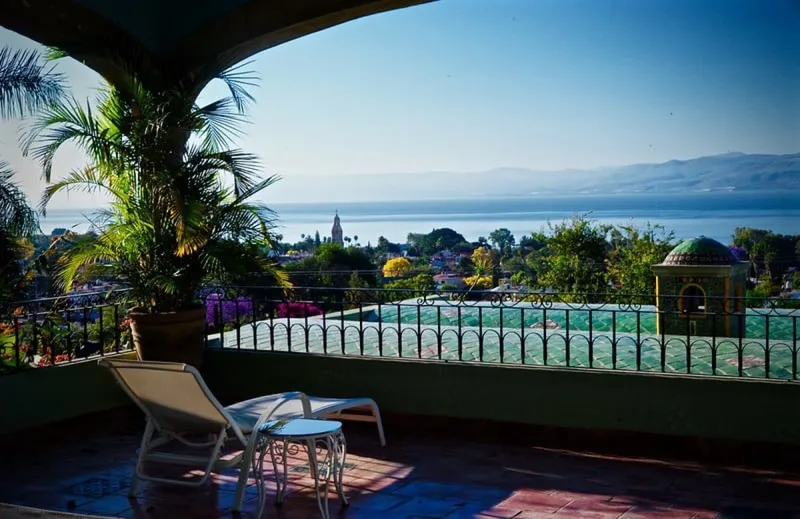 Lake Chapala shoreline near Ajijic with blue water and hazy highland mountains
