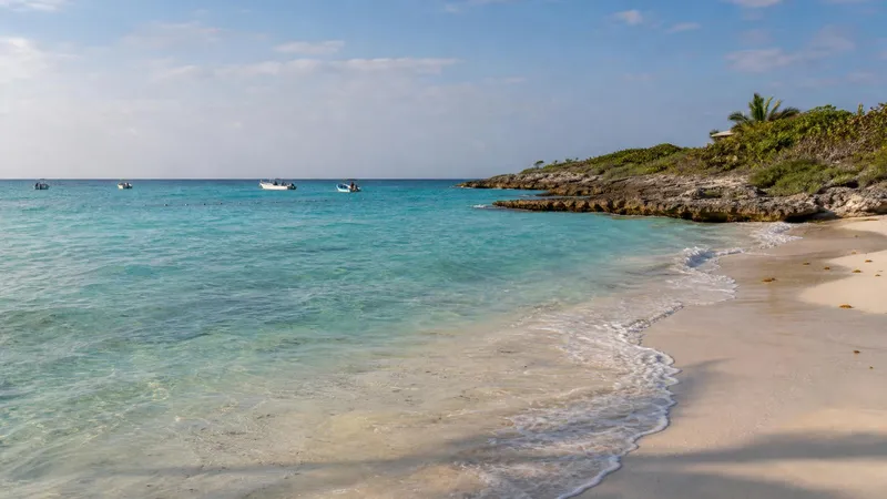 Akumal Bay in April with turquoise water and pale sand on the Riviera Maya