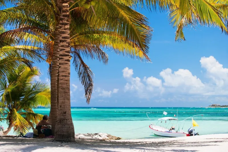 Calm turquoise water and pale sand on Akumal Bay