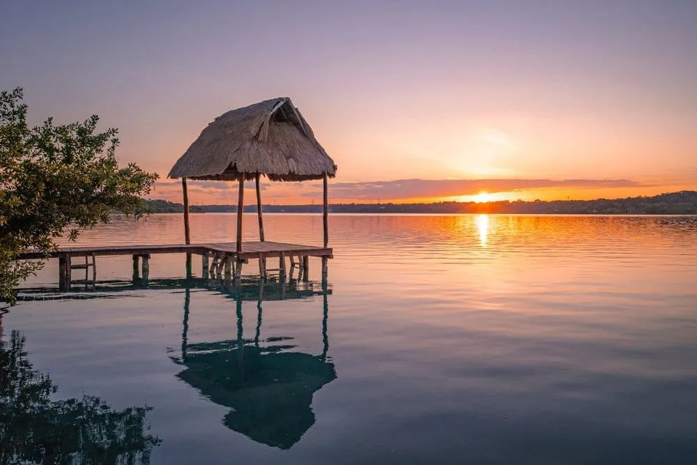 Sunset colors reflected on Bacalar's Seven Colors Lagoon