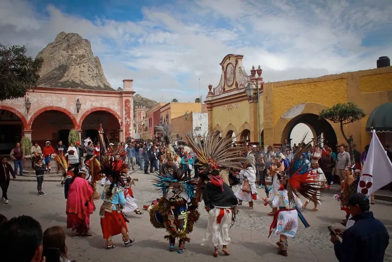 People gathering in Bernal plaza during a green-season Querétaro trip