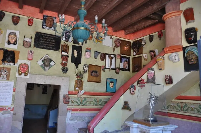 Traditional masks displayed inside a museum in Bernal during an August rainy-season trip