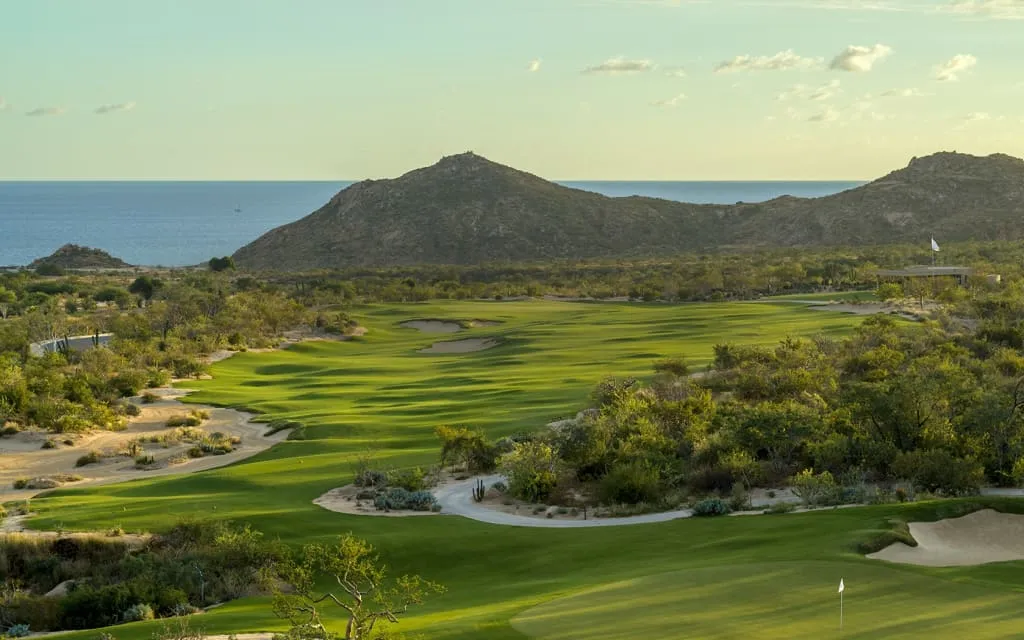 Twin Dolphin fairway curving through desert terrain above the Sea of Cortez