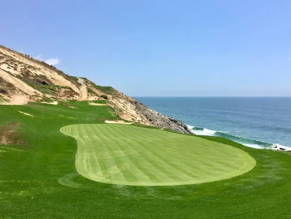 Quivira Golf Course hole set above rocky Pacific coastline in Cabo San Lucas