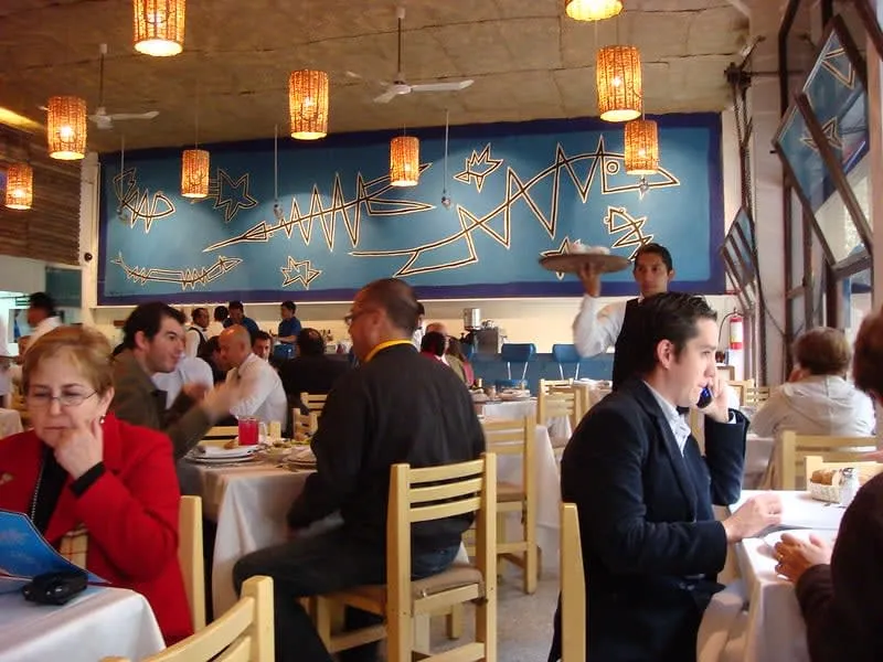 Contramar seafood table with grilled fish and coastal Mexican dishes