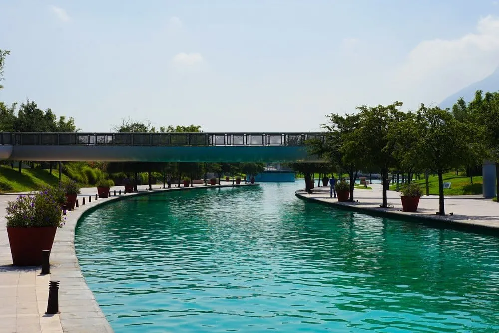 Paseo Santa Lucía artificial waterway in Monterrey with pedestrian bridges, reflecting pools, and restaurant terraces lining the 2.5 km canal connecting the Macroplaza to Parque Fundidora