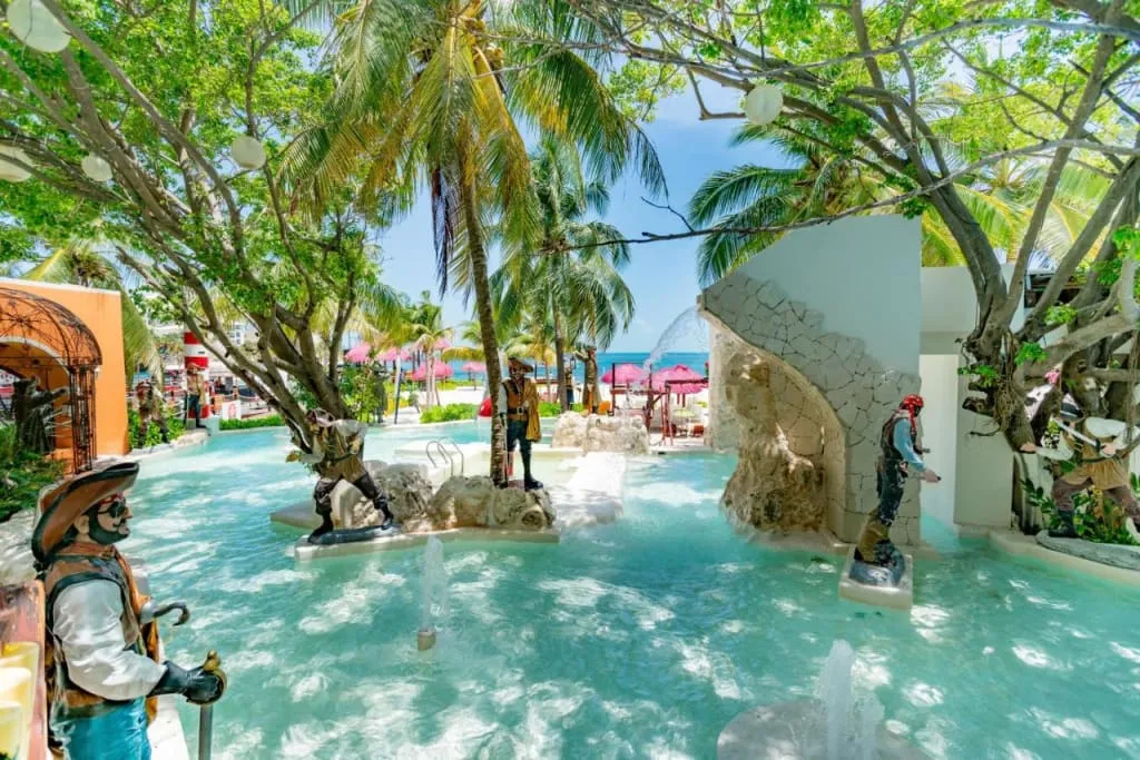 Grand Oasis Palm Cancun family resort pool near the beach and pier