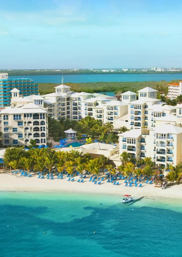 Occidental Costa Cancun resort grounds with pool and garden-facing rooms