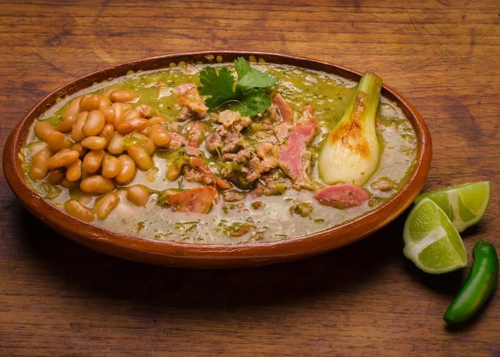 Bowl of carne en su jugo beef stew with bacon and beans, Guadalajara