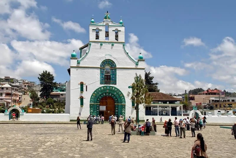 Temple of San Juan Bautista in Chamula Chiapas with its distinctive white facade and pine-needle decorated interior