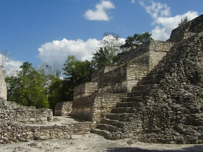 Stone Maya ruins surrounded by jungle near Calakmul