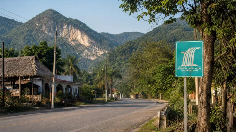 Green hills and a quiet road outside Ciudad Valles in the December dry season