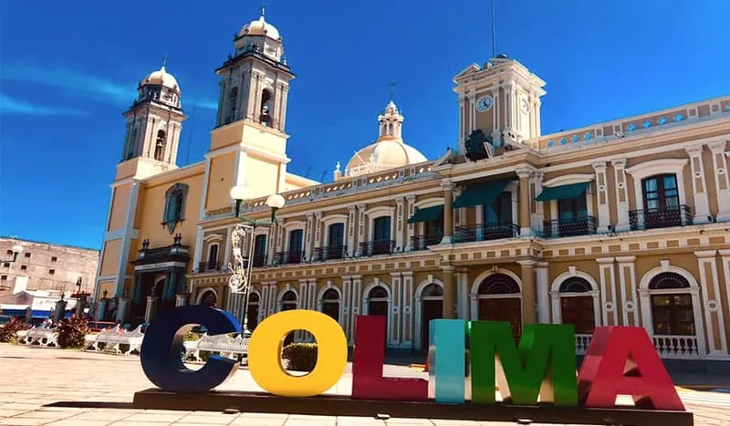 Central Colima street with palms and clear January dry-season light