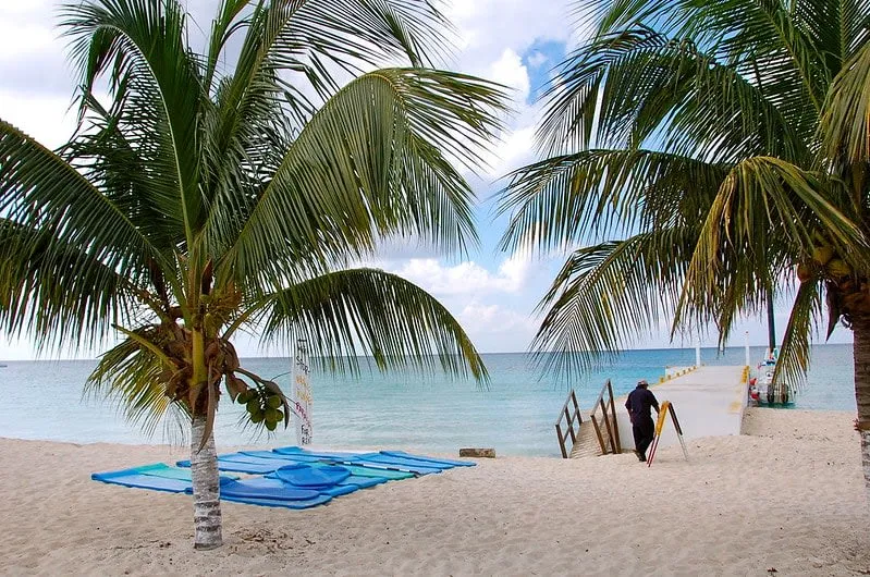 Rocky shoreline and clear snorkeling water at Playa Corona in Cozumel
