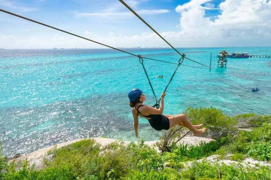 Garrafon reef park coastline with blue water and rocky shore on Isla Mujeres