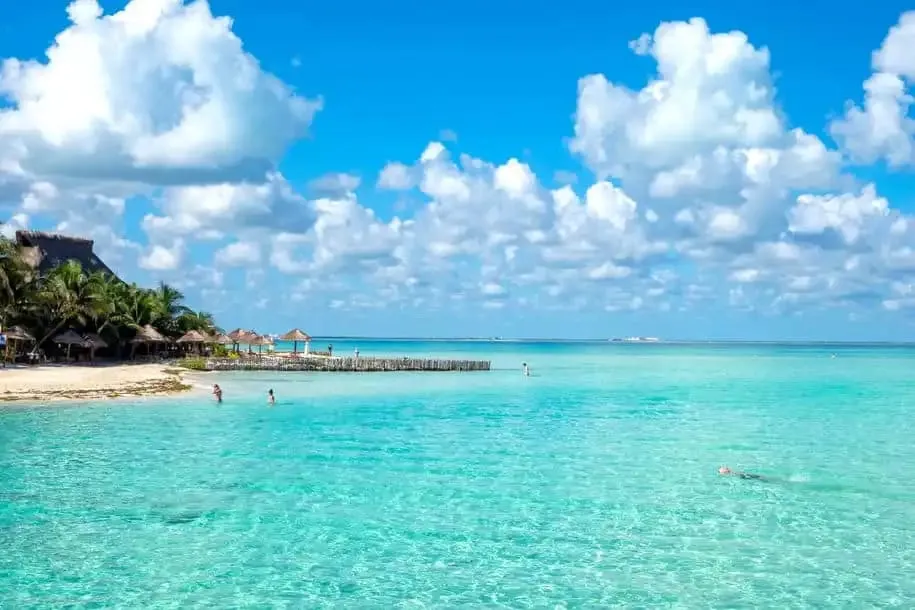 White sand and shallow turquoise water on Costa Mujeres Beach