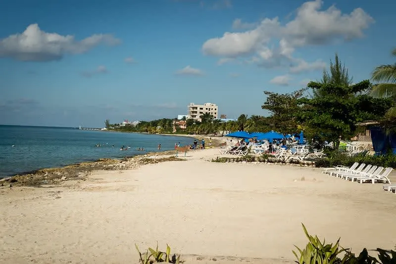 Clear shallow water and restaurant area at Las Tortugas Beach