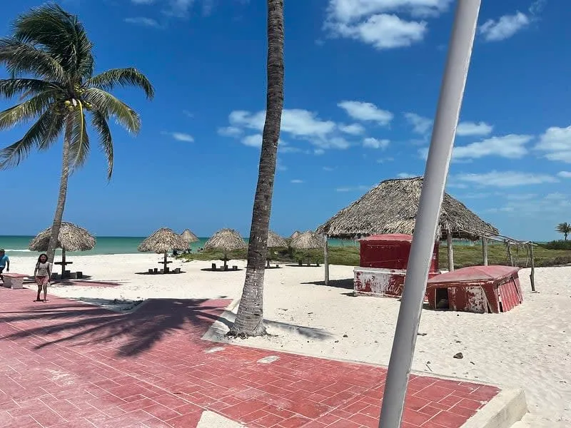 Wide white-sand beach and calm turquoise water on the El Cuyo coast