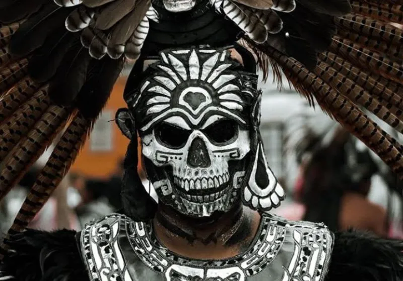 Mictlantecuhtli costume with skull mask and feathered headdress