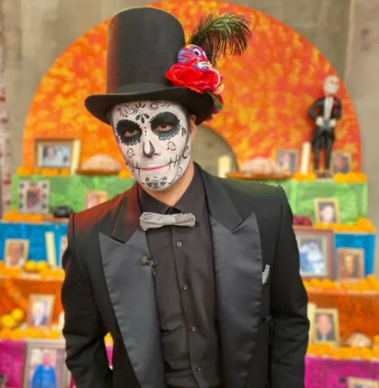 Catrín costume with suit cane hat and skull makeup