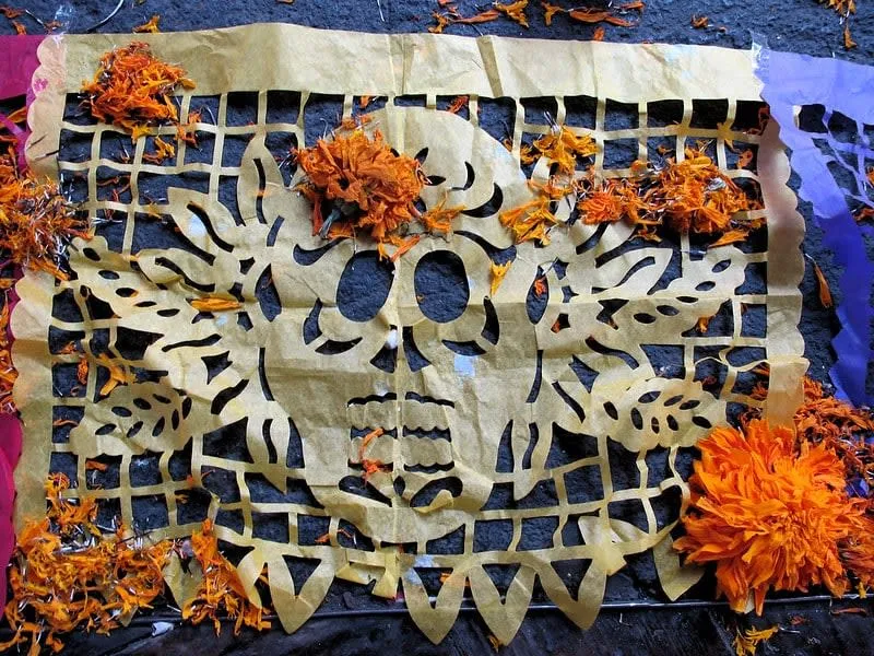 Papel picado banners with skull patterns for an ofrenda
