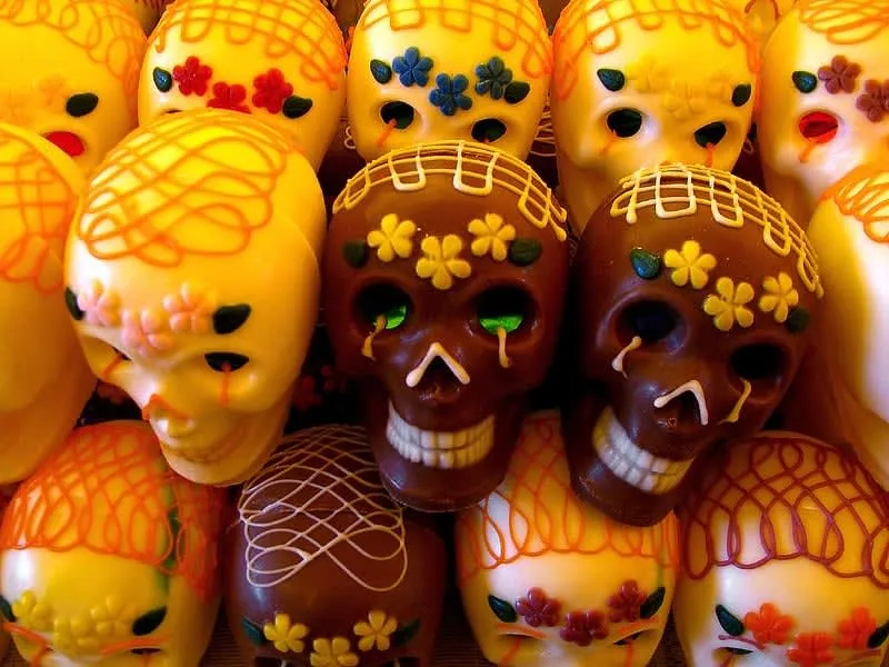 Decorated sugar skulls with colorful icing and names