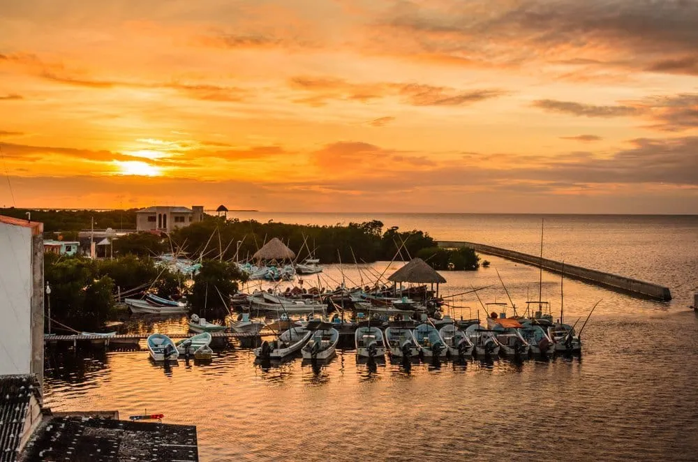 Pastel wooden houses and fishing-port street in San Felipe Yucatan
