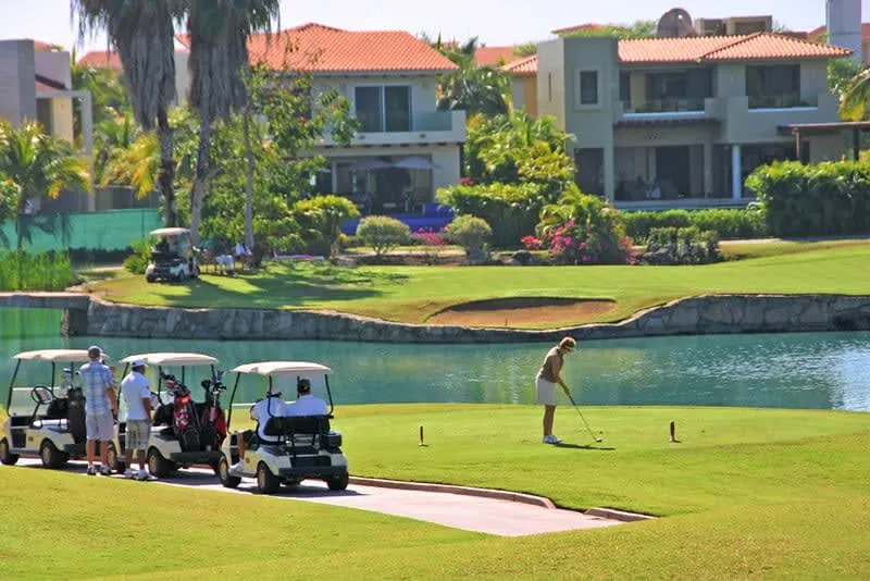 El Tigre Golf Course fairway in Nuevo Vallarta bordered by palms and water hazards