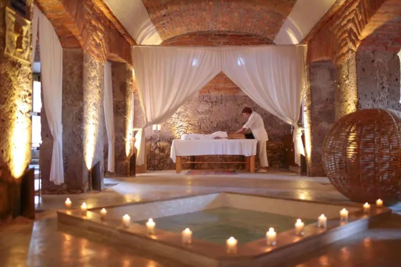 Colonial hacienda converted to luxury hotel with stone arches and gardens in Mexico