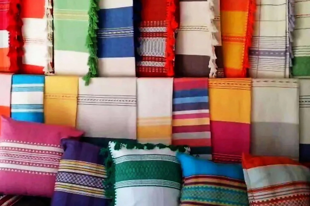 Handwoven rugs and textile crafts displayed near the Mitla market