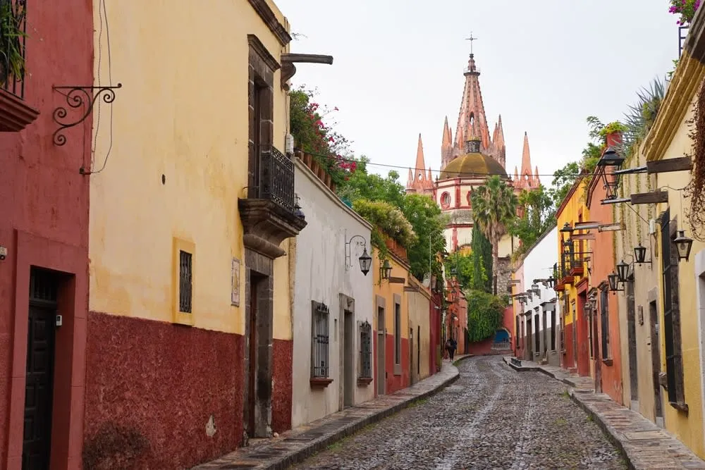 San Miguel de Allende colonial streets and church towers at golden hour