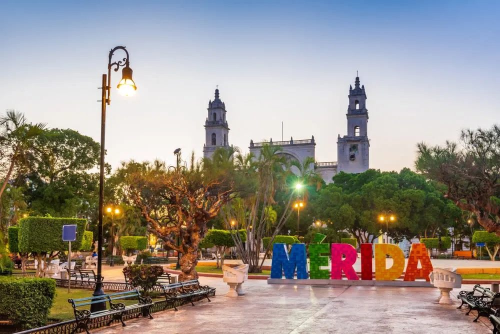 Merida colonial plaza with traditional architecture and shaded walkways