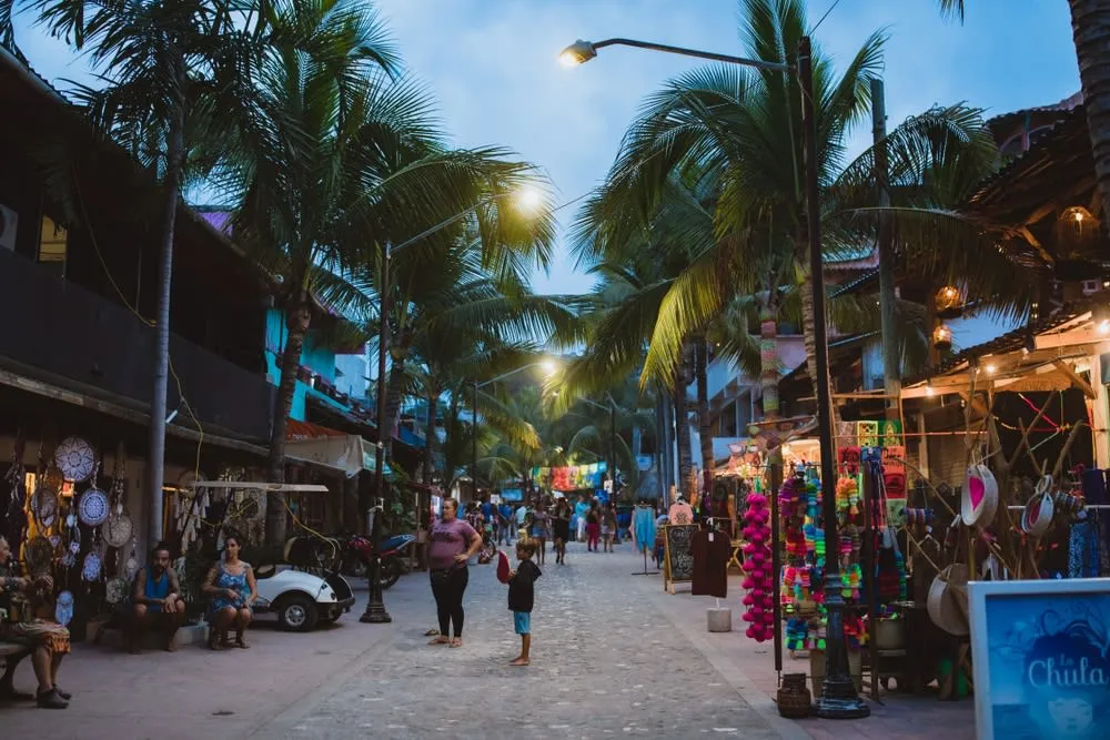 Colorful Sayulita street leading toward shops and beach cafes