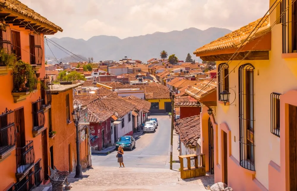 San Cristobal de las Casas cobblestone street with colorful colonial facades