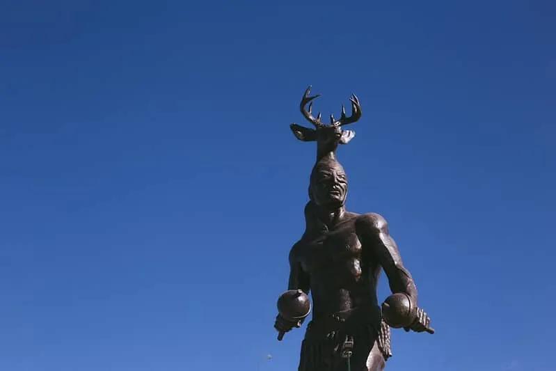 Yaqui monument in Sonora with sculpted figures and desert surroundings