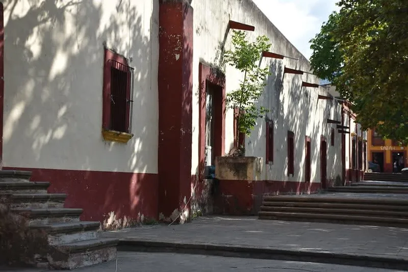 Jalpan de Serra town in August with warm rainy-season pacing, mission visits, and mountain-road logistics