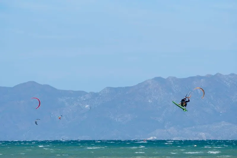 Kitesurfing at La Ventana Bay Baja California Sur with colorful kites over turquoise water — one of Mexico's top kitesurfing destinations with consistent El Coromuel winds