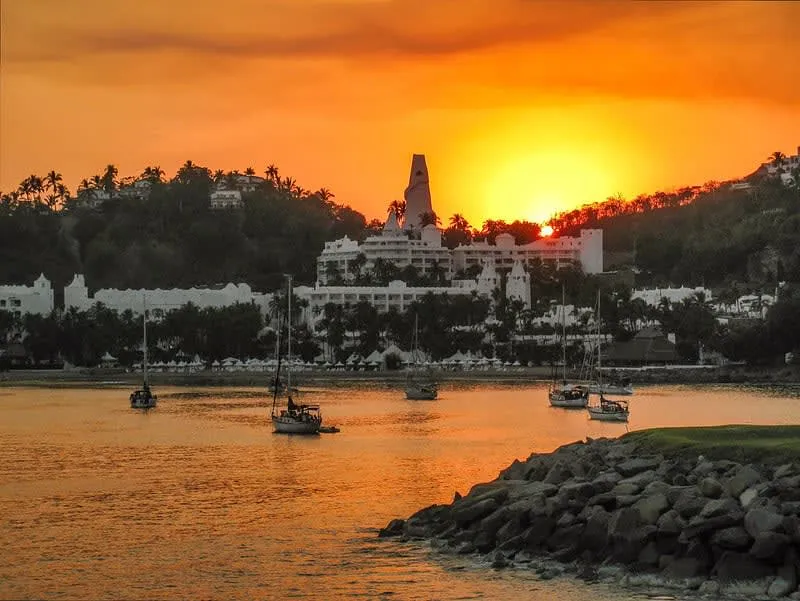 White Las Hadas resort buildings above Manzanillo bay and marina in dry-season light