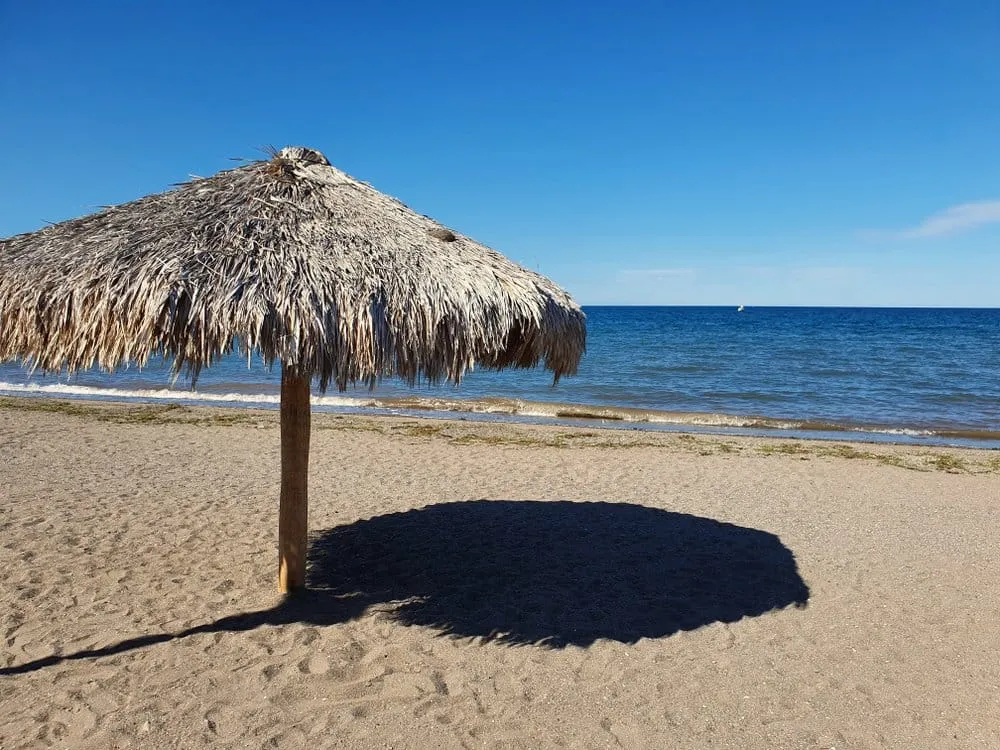 Calm turquoise beach backed by arid mountains on the Sea of Cortez