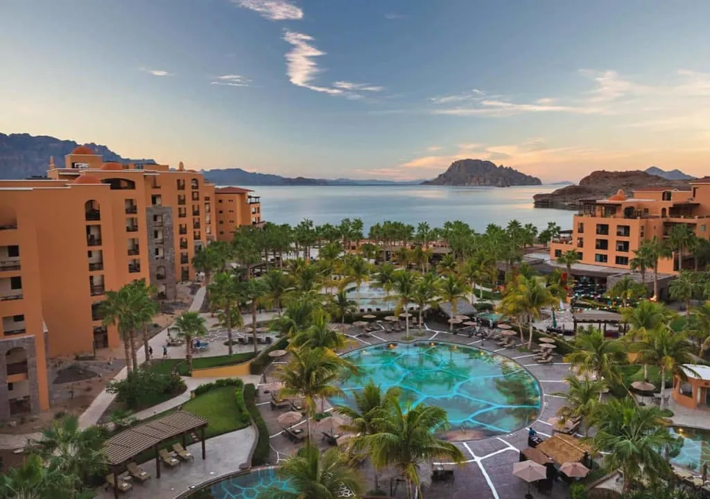 Resort pool and guest rooms near the Sea of Cortez in Loreto