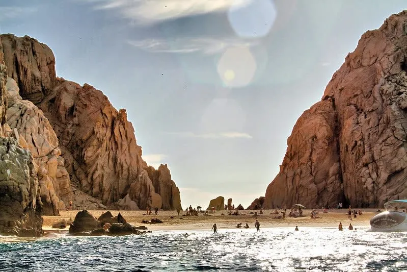 Lover's Beach at Land's End Cabo San Lucas — pristine secluded beach accessible only by water taxi with clear turquoise Sea of Cortez water
