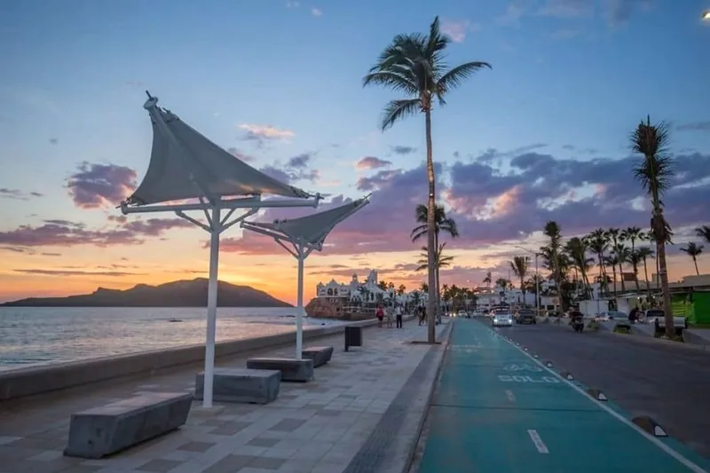 Mazatlan shoreline with tall beachfront towers beside calm Pacific water