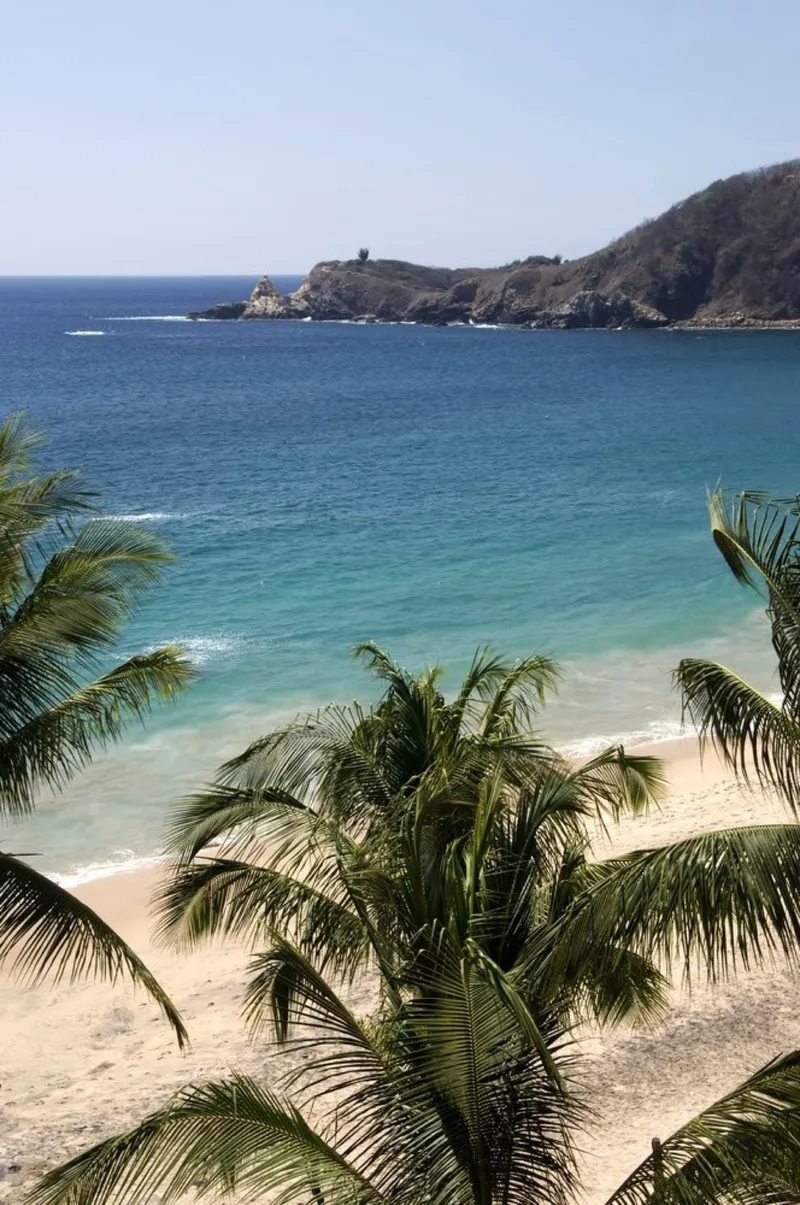 Mazunte beach and rocky Oaxaca Coast scenery during clear November dry-season weather