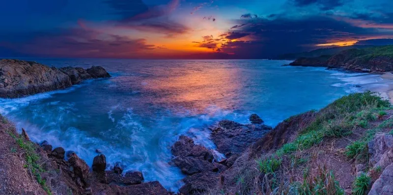 Mazunte coastline and beach-town hills during hot May Oaxaca Coast weather
