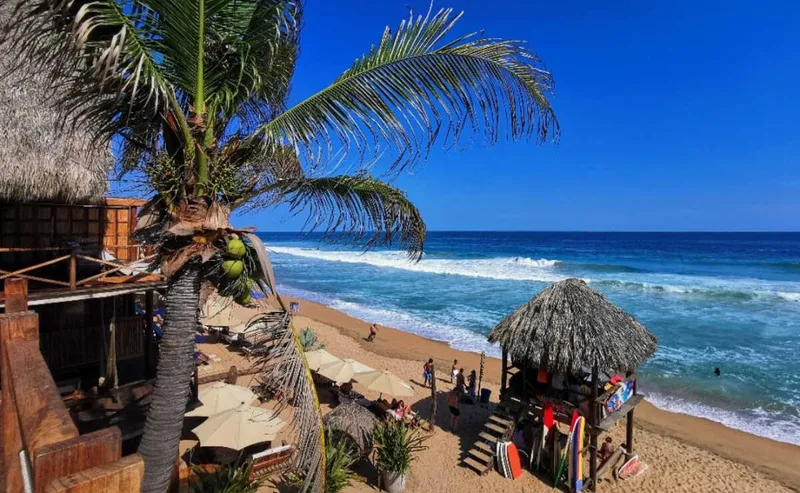 Mazunte beach on the Oaxacan coast — small bay with gentle waves, perfect for swimming and sunset views near Puerto Escondido
