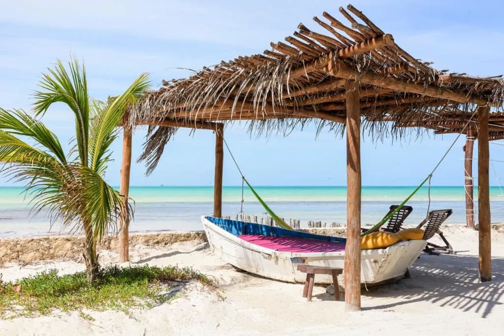 Holbox island beach venue with palm trees and Caribbean sand