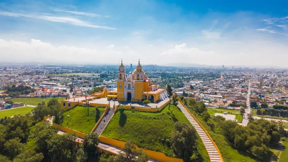Colonial street scene near Cholula’s pyramid and churches